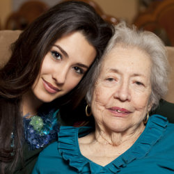 caregiver hugging elderly patient